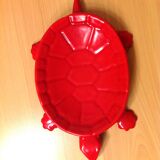 Turtle pocket emptier in enameled red cast iron by Castirone France