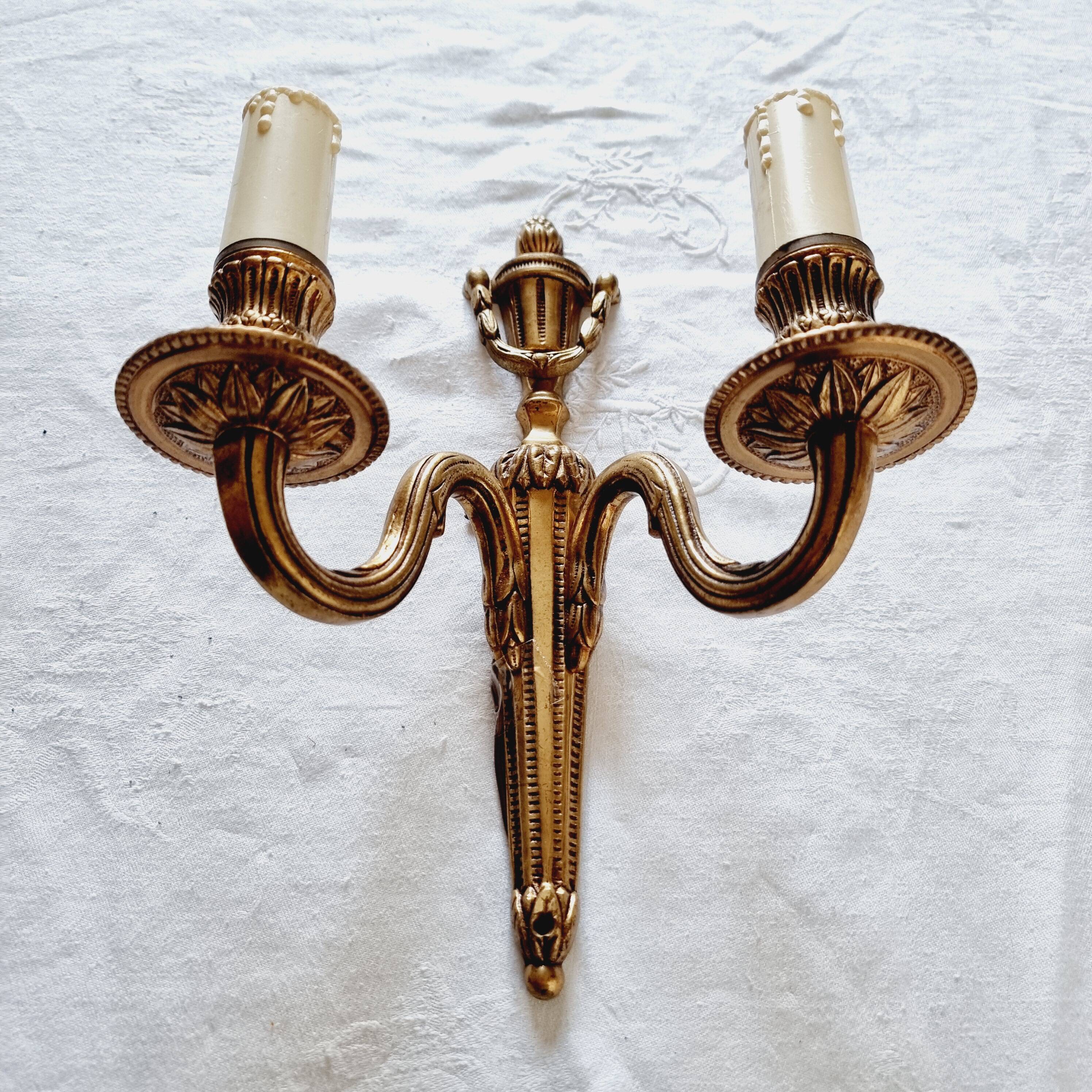 French Empire-style wall sconce or chandelier in bronze with an antique gold patina.