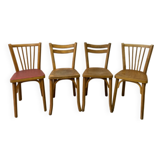 Series of 4 mismatched Baumann chairs