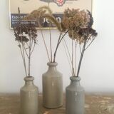 Three bottles of Mercure Bourdon Frères Paris sandstone