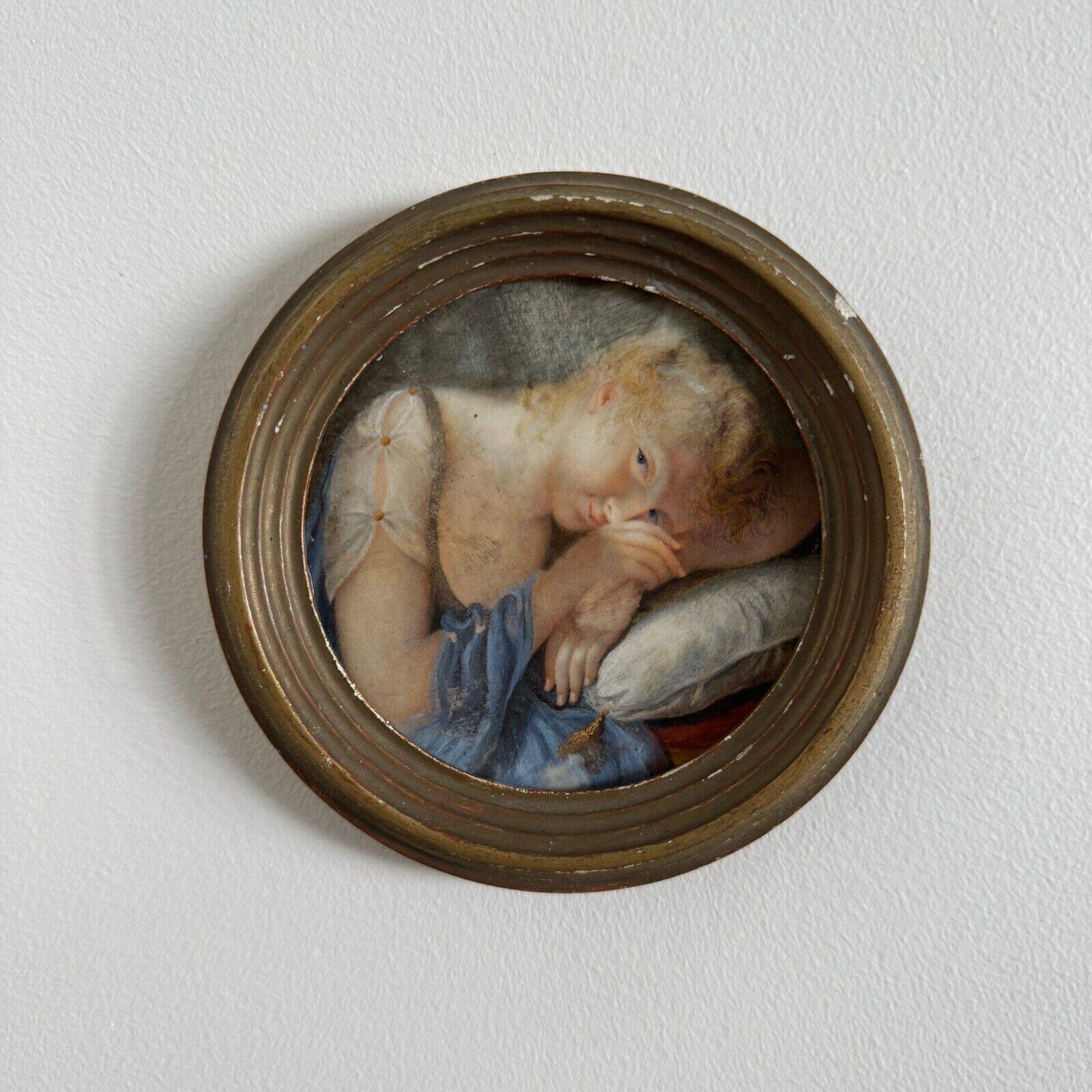 19th century miniature of a young girl with her head resting on a cushion