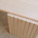 Table basse vintage en travertin par les éditions Roche Bobois