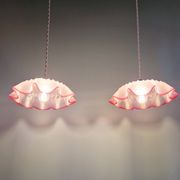 Pair of clear and pink satin glass scalloped pendant lights, 1920s-30s
