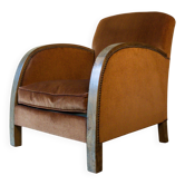 Art Deco club armchair in wood and rust brown velvet, circa 1930.