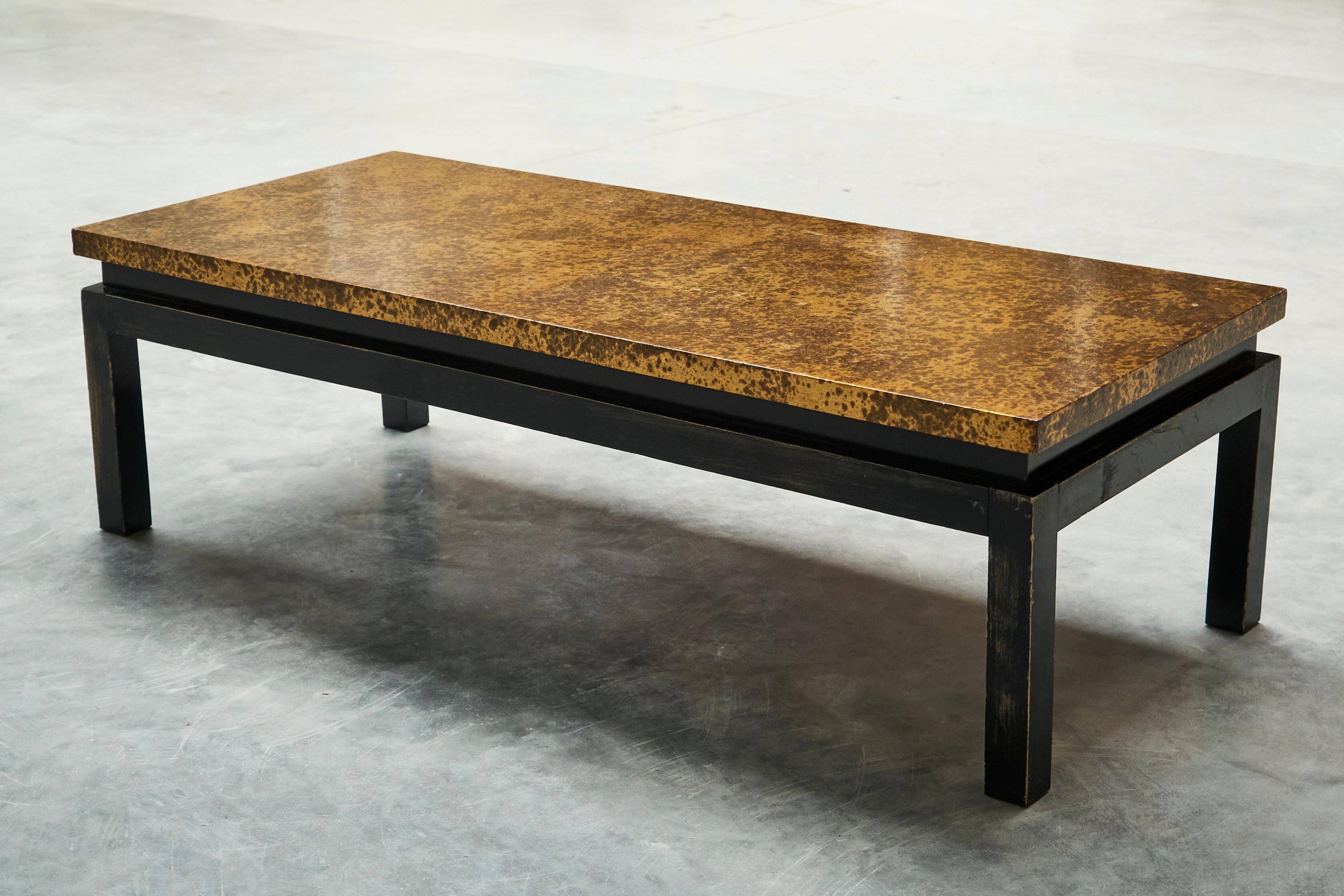 Modernist coffee table with a patinated gold top, 120x52.5x36 cm, mid-20th century.