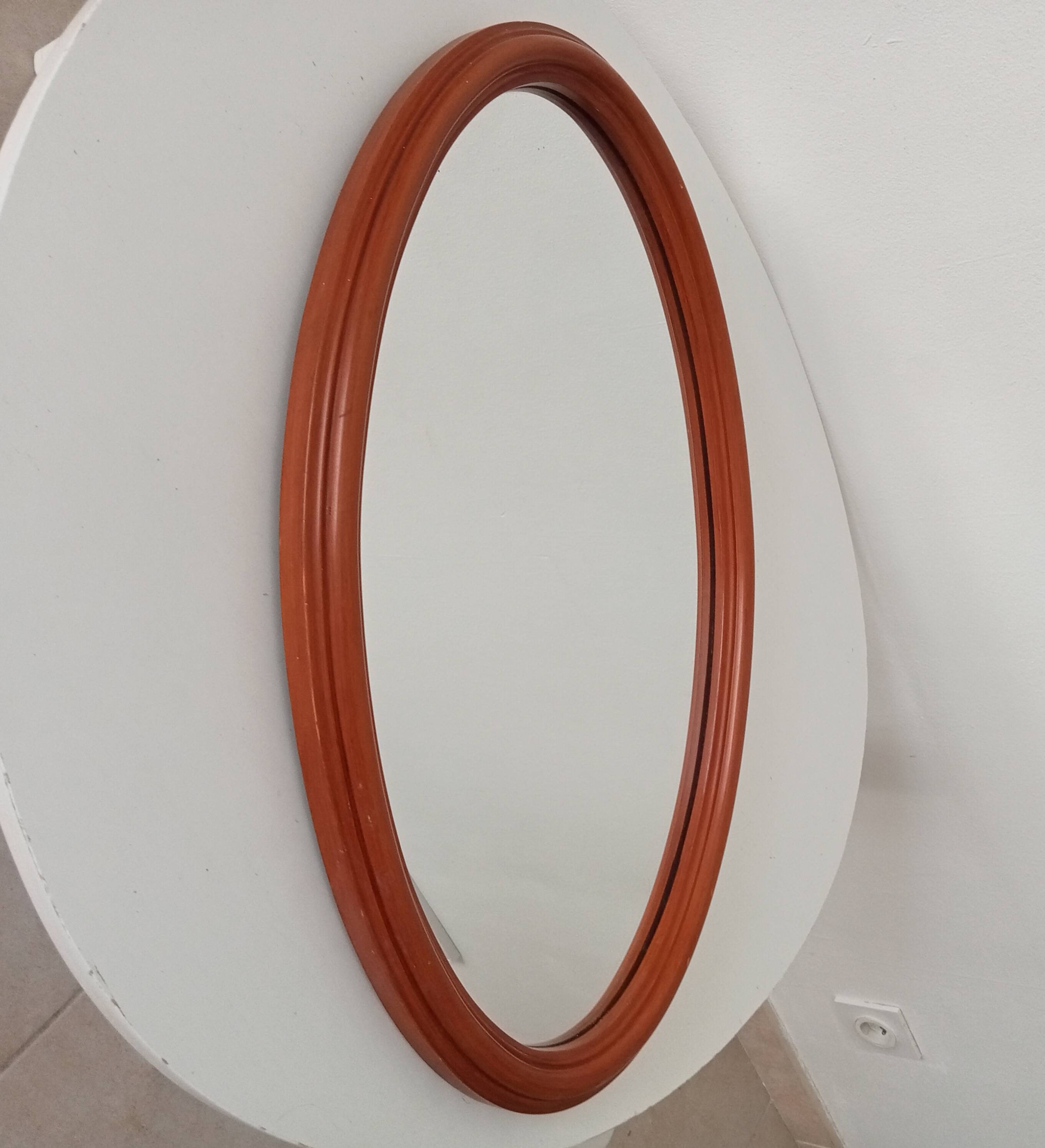 Vintage oval wooden mirror "caramel" from the 1960s.