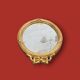 Antique oval mirror in gilded resin with Louis XVI style knot decoration