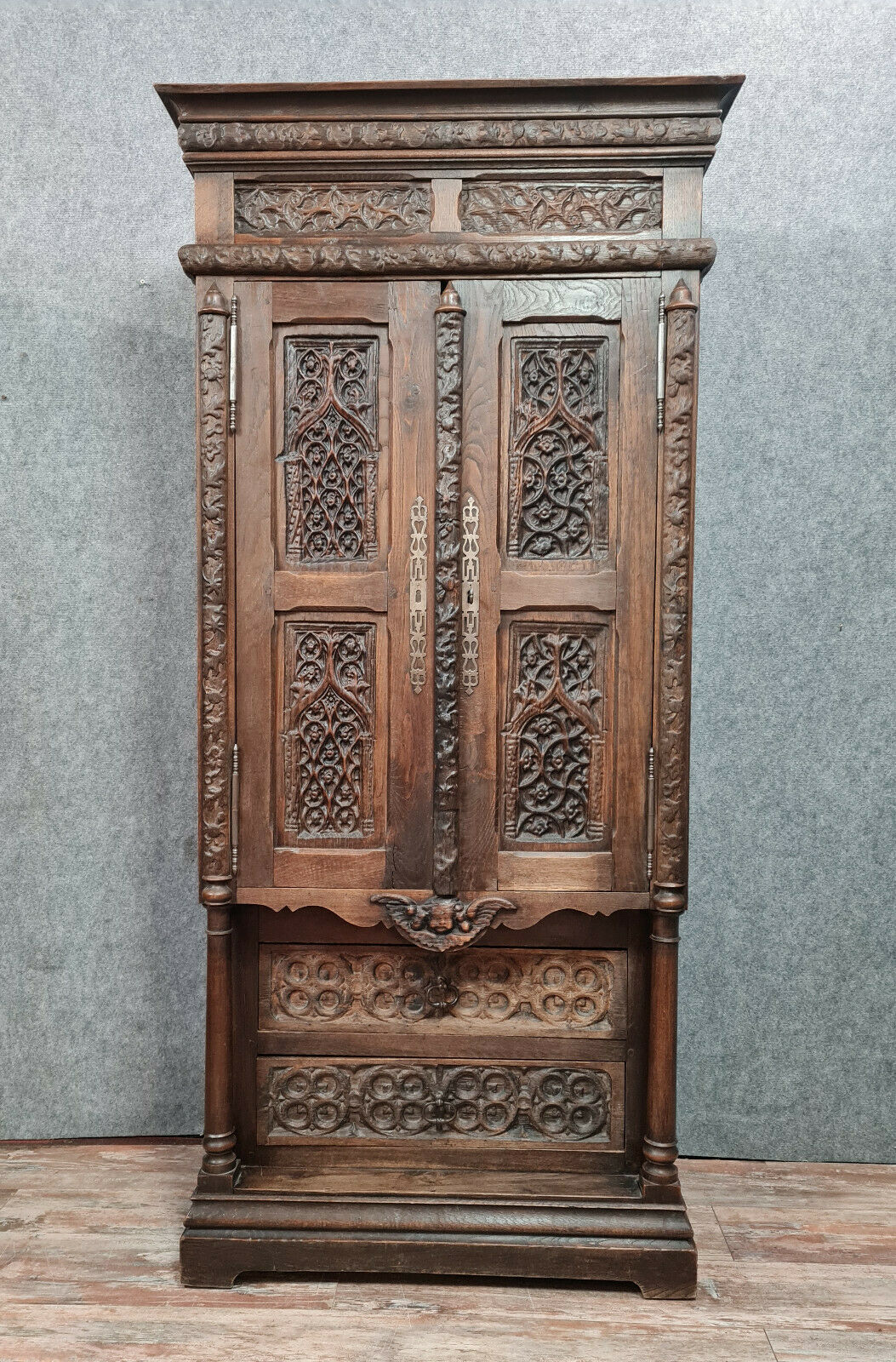 Gothic Renaissance style cabinet with solid oak putto around 1850