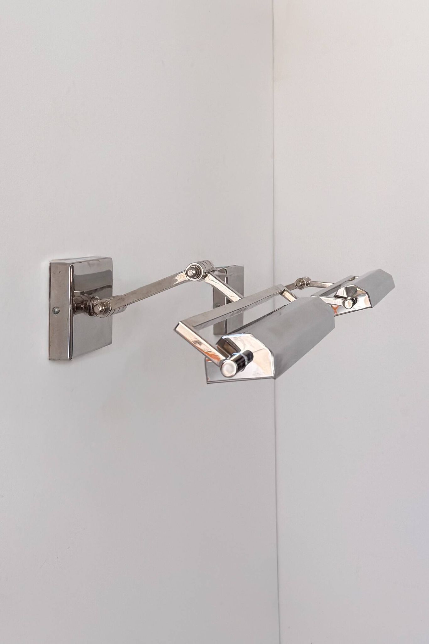 Pair of adjustable vintage wall lights in chrome, France, 1970.