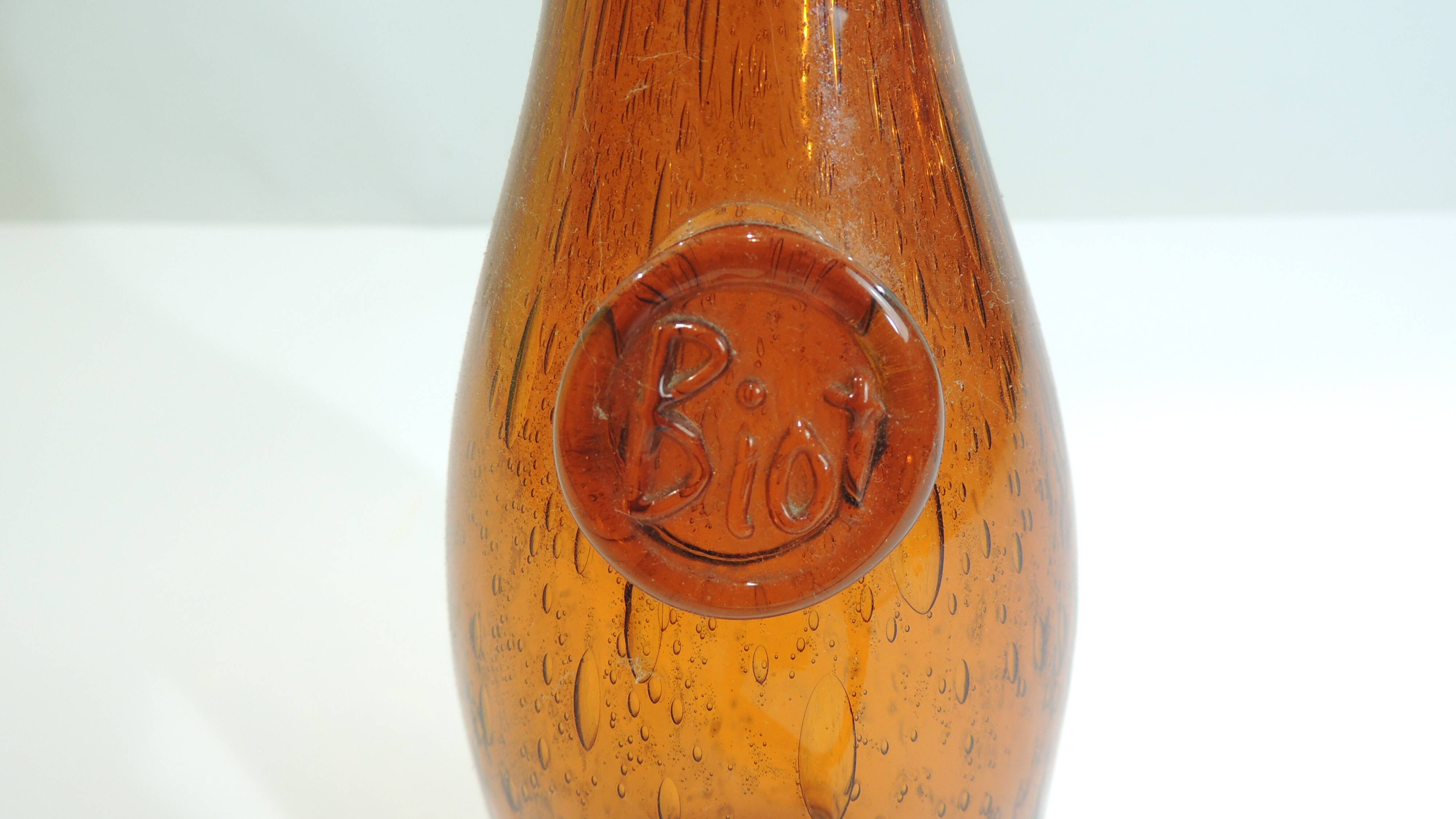 Amber bottle in bubbled blown glass, signed Biot – France, vintage 1970s