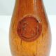 Amber bottle in bubbled blown glass, signed Biot – France, vintage 1970s