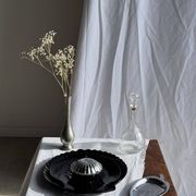 Pair of vintage black glass shell dishes D32 and D26