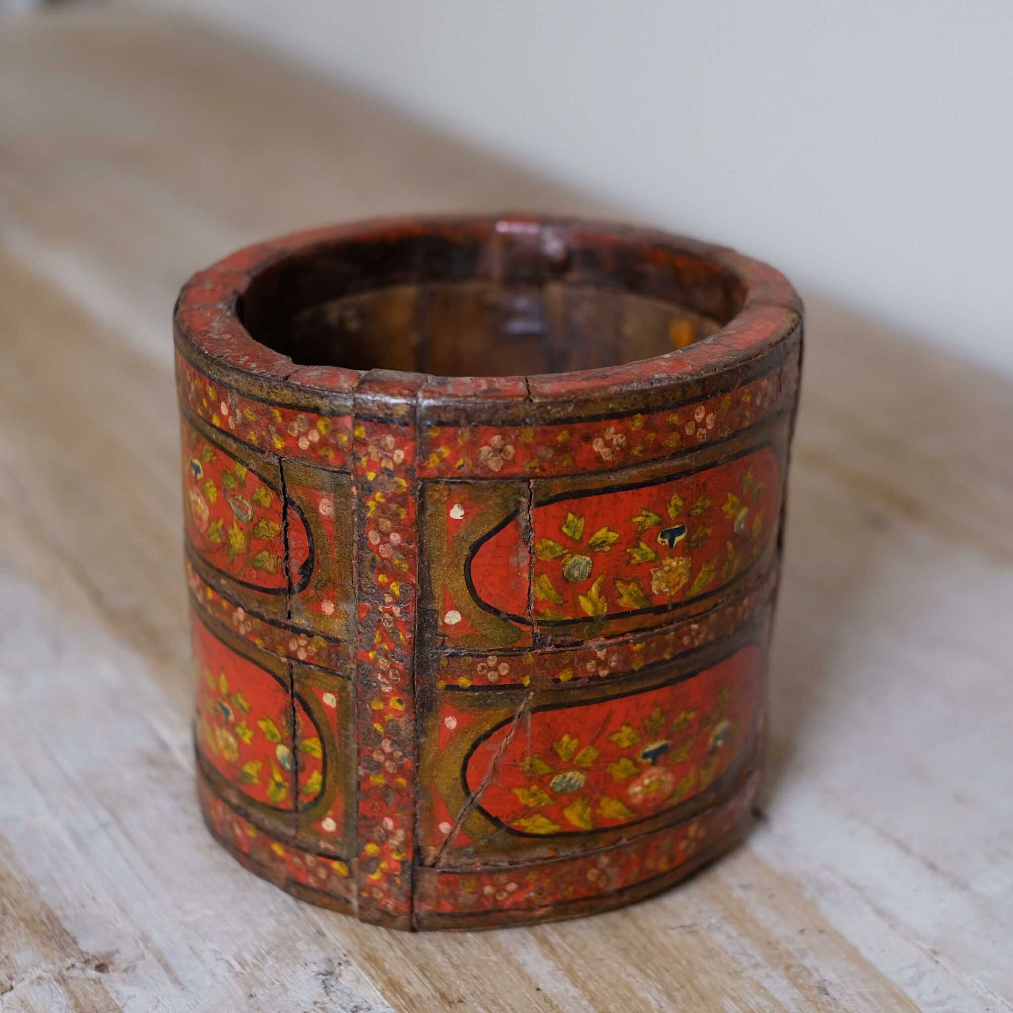 Antique wooden pot painted by hand