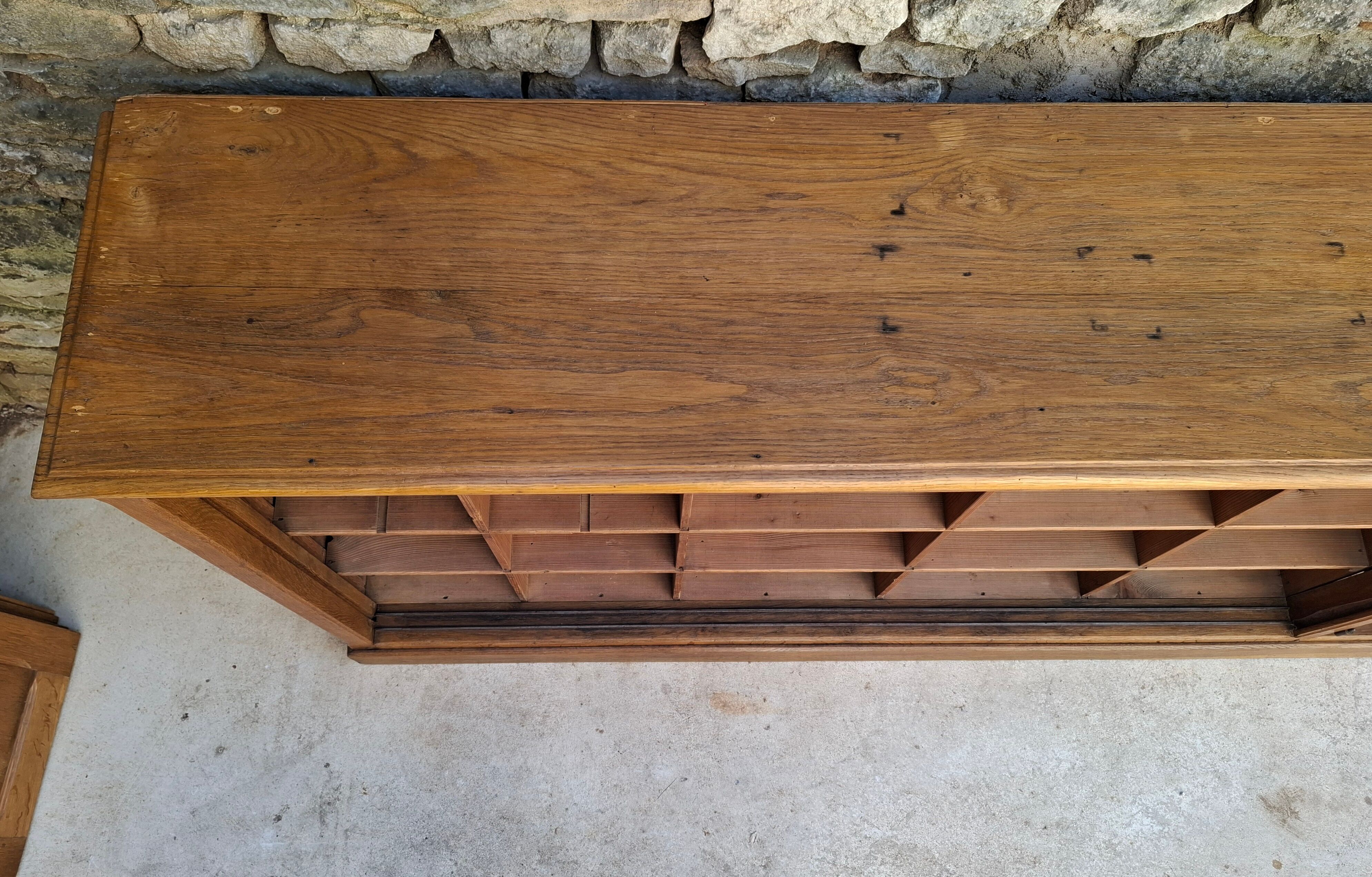 Oak workshop furniture with sliding doors.