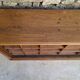 Oak workshop furniture with sliding doors.