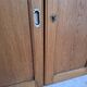 Oak workshop furniture with sliding doors.