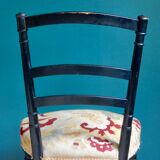 Black Napoleon III chair lined with phoenix
