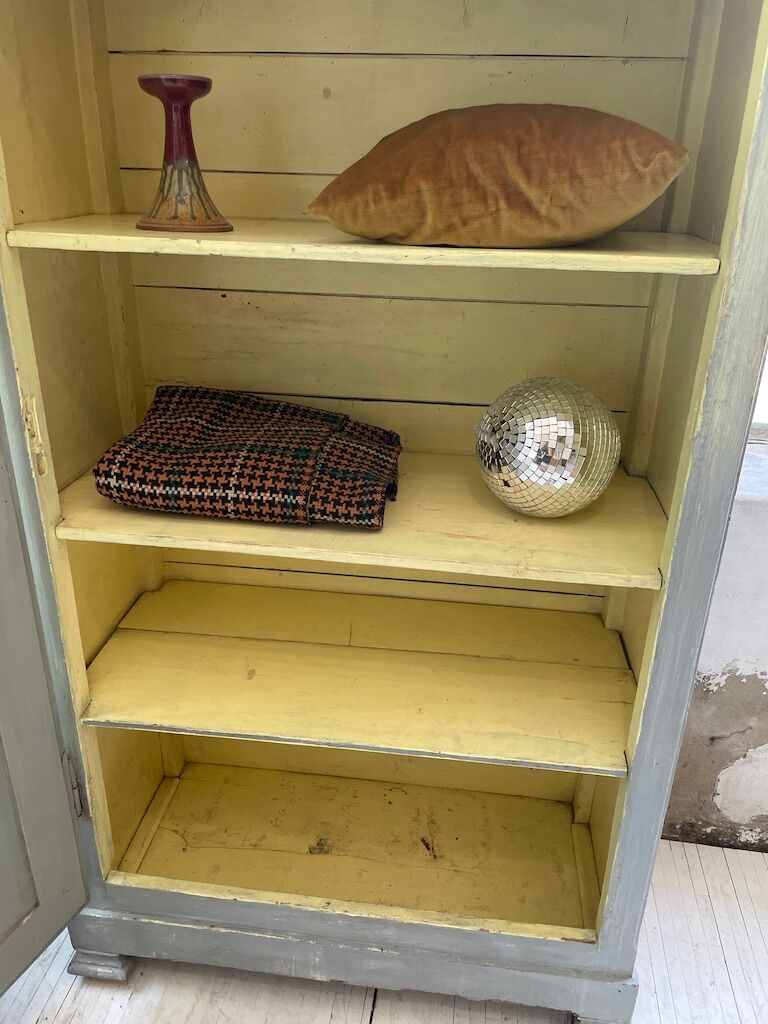 Blue patinated cap cabinet