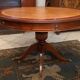 Circular table in light mahogany and leather base claw English style
