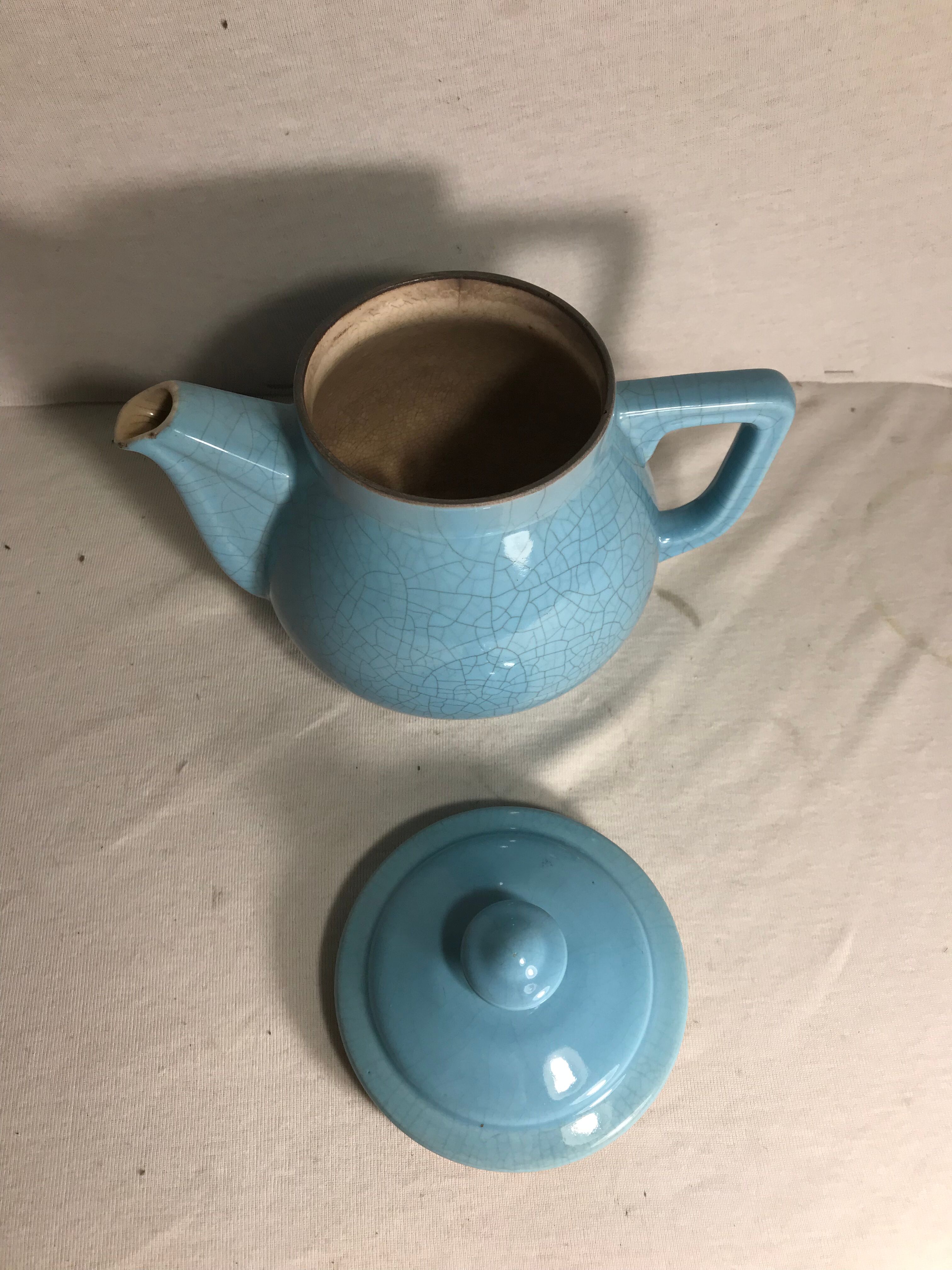 Cracked blue ceramic vintage teapot