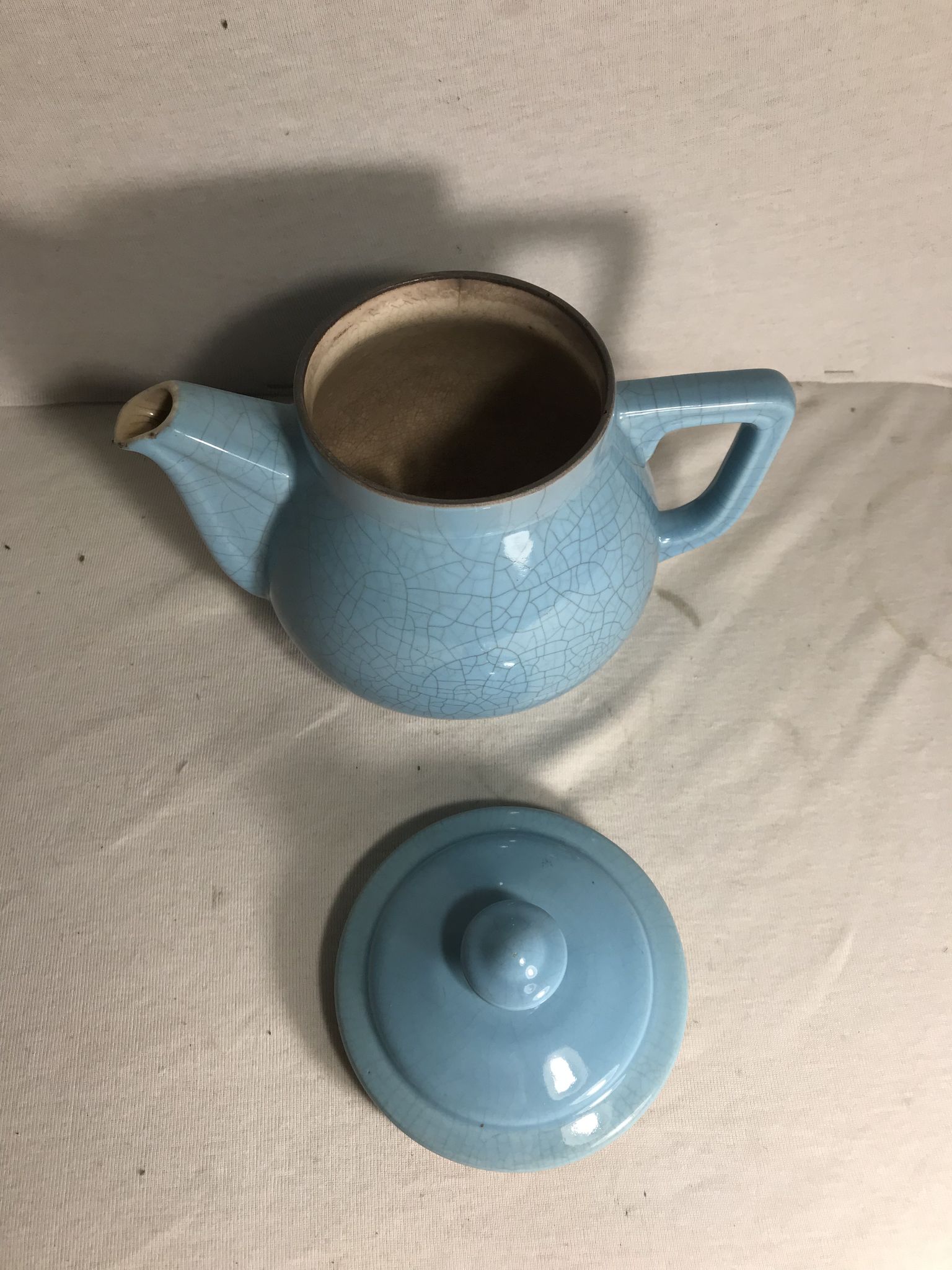 Cracked blue ceramic vintage teapot