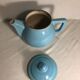 Cracked blue ceramic vintage teapot
