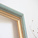 Frame in gilded and green wood