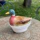 Charming Duck, slip, enameled ceramic terrine, white basket-shaped base and lid