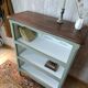 Grey-green bib, dark wood and Toile de Jouy.