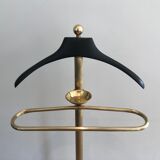 Neoclassical style valet stand in brass and black lacquered wood. French work. Circa 1940