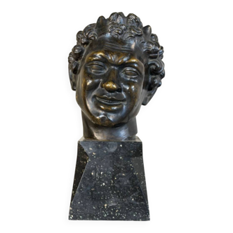 Head of a faun smiling, bronze after the antique, 19th century.