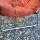 Fauteuil en velours brique