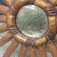 Miroir soleil en bois et stuc doré, années 50