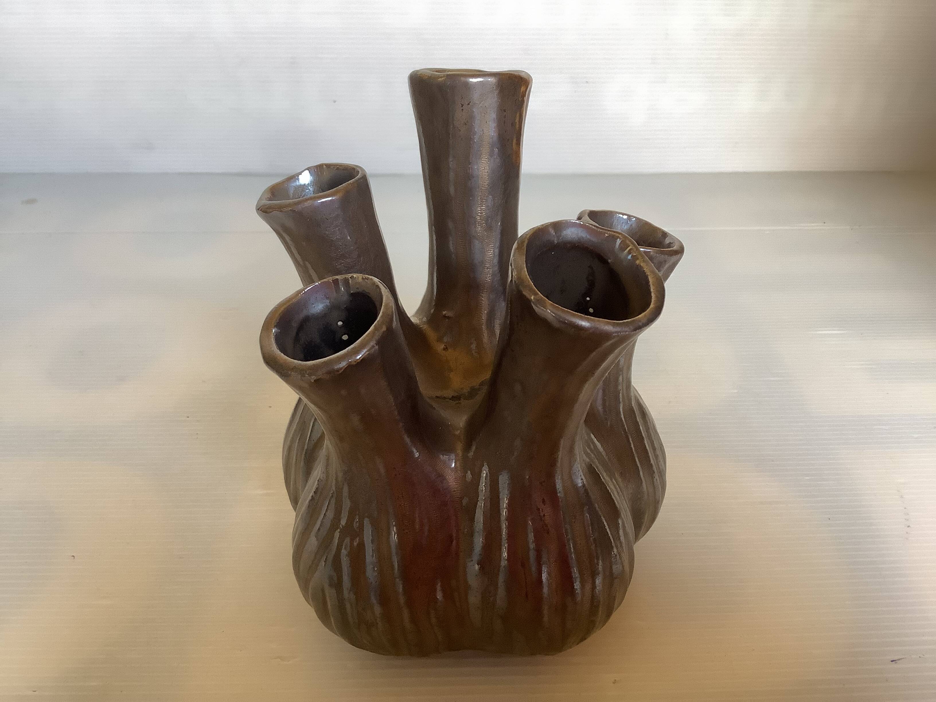 Tulip vase with ceramic flowers in brown and gold.