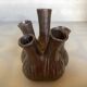 Tulip vase with ceramic flowers in brown and gold.
