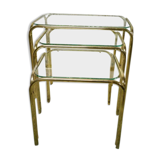 Trio of nesting tables in gold metal