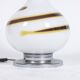 White glass lamp decorated with a brown and yellow spiral, 1970s