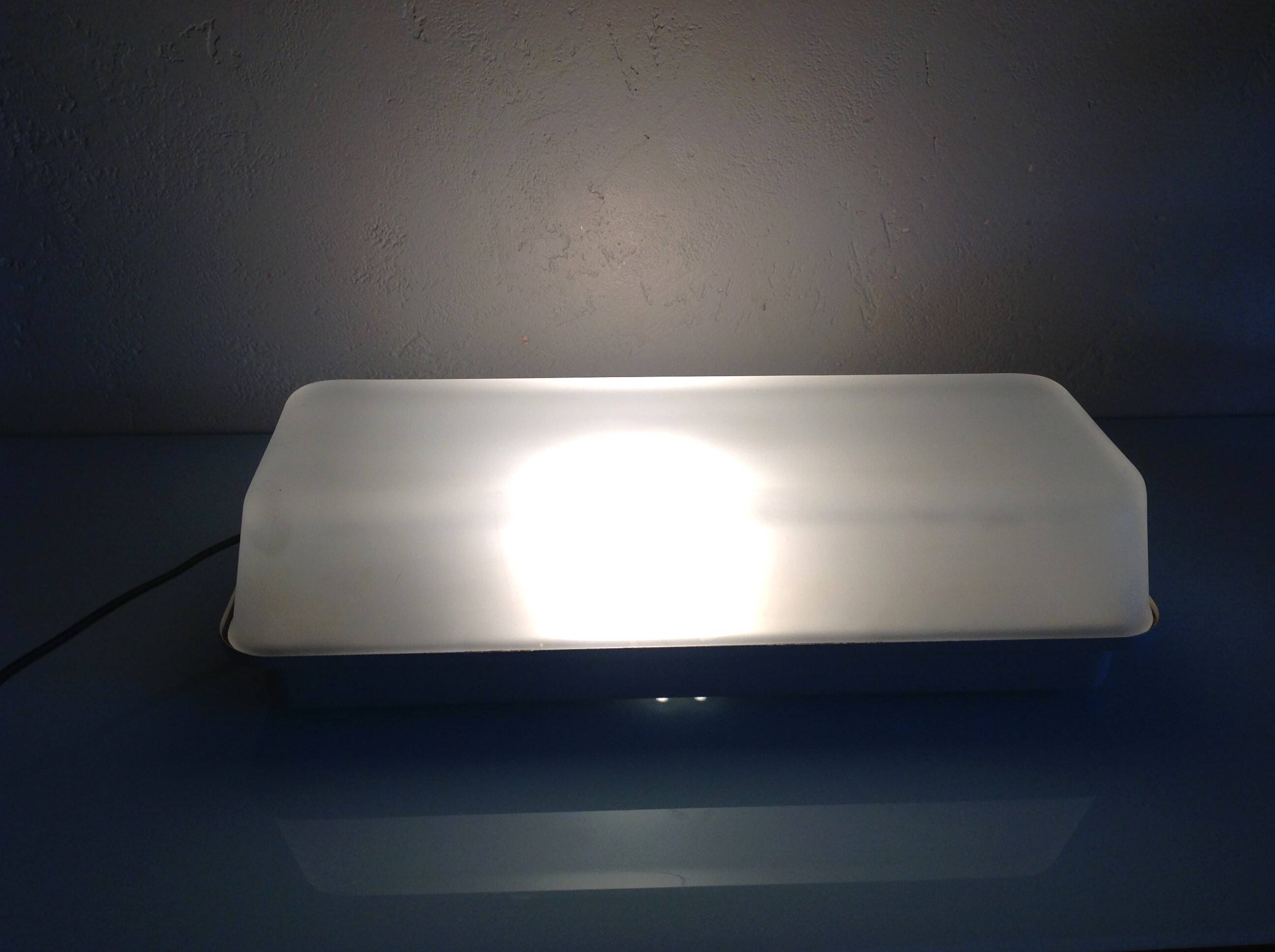 Rectangular porthole wall light in industrial/70s style frosted glass