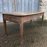 Antique farmhouse table in solid oak with tapered legs and 1 drawer at the end.
