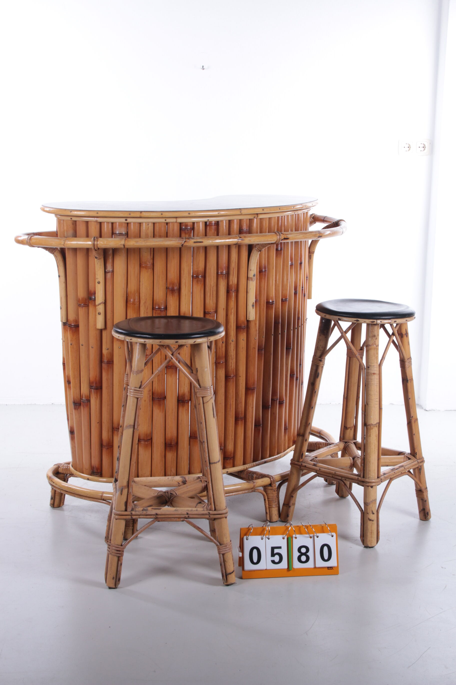 Vintage bamboo Tiki bar cocktail bar with 2 bar stools.
