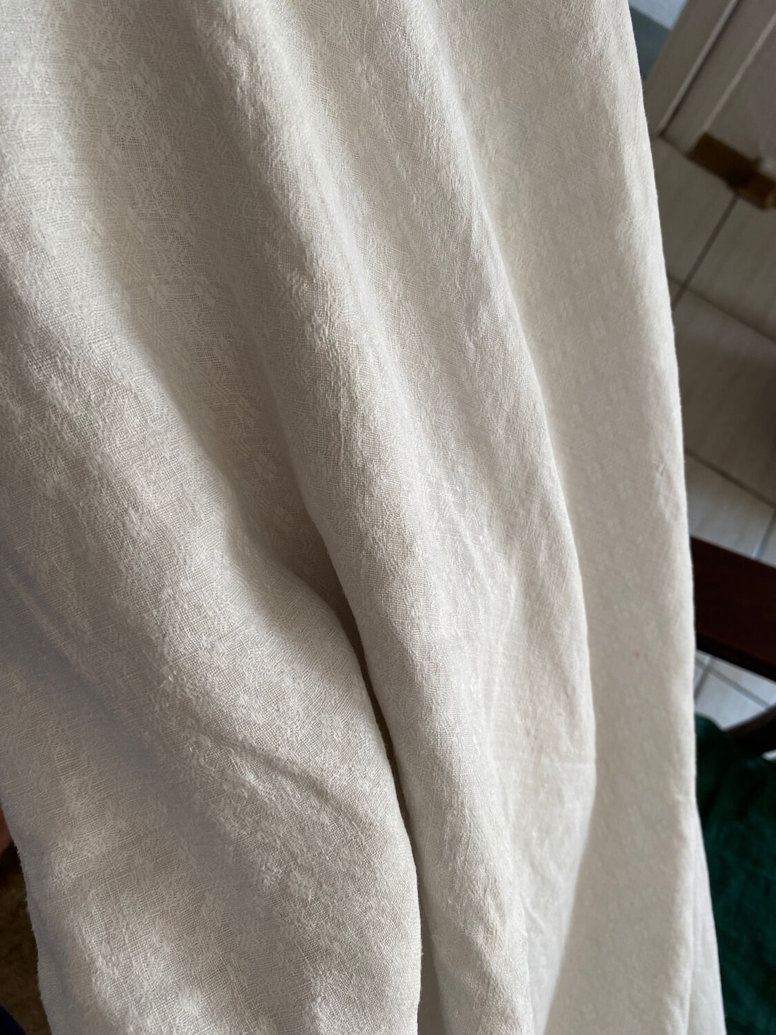Old white cotton tablecloth.