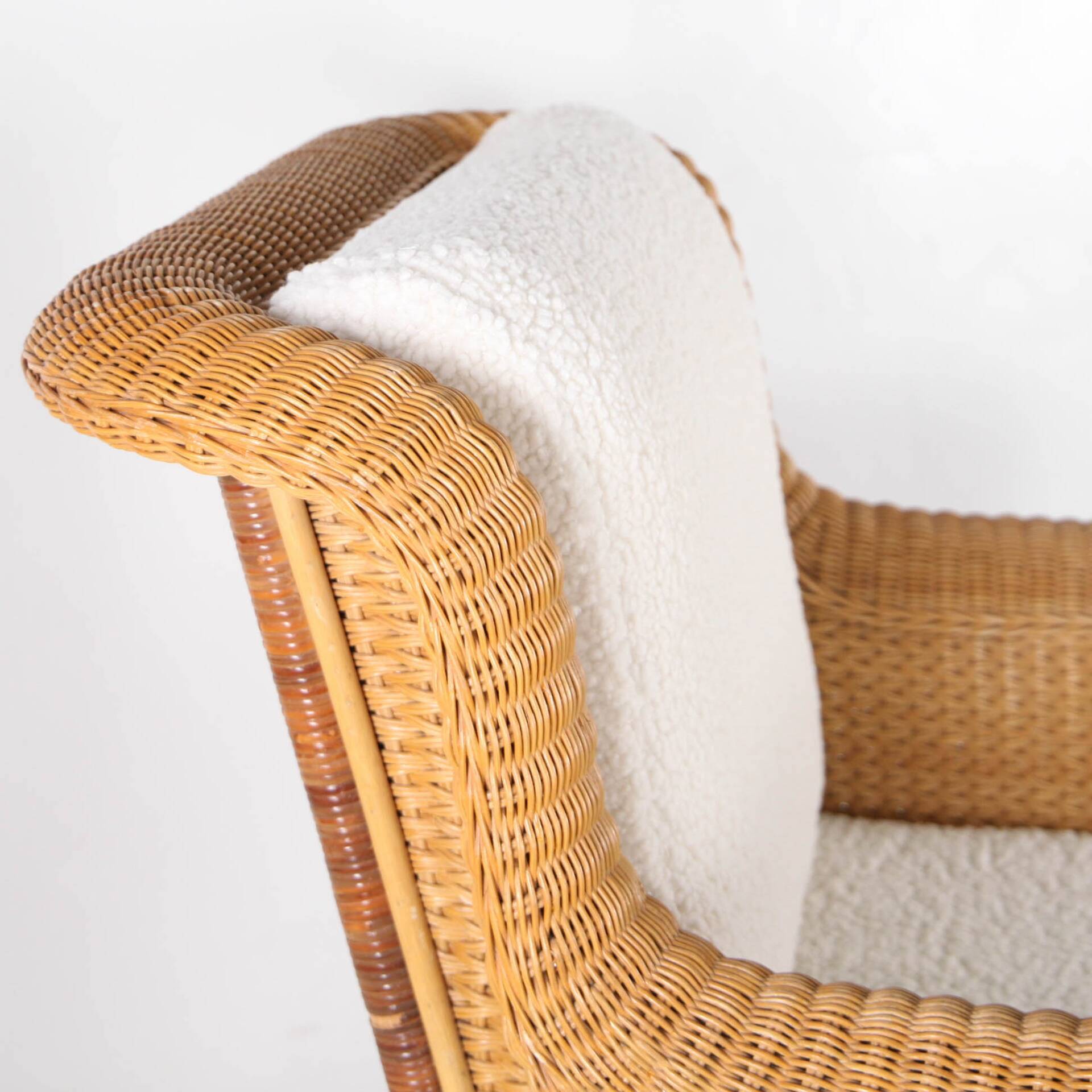 Large wicker armchair and its ottoman