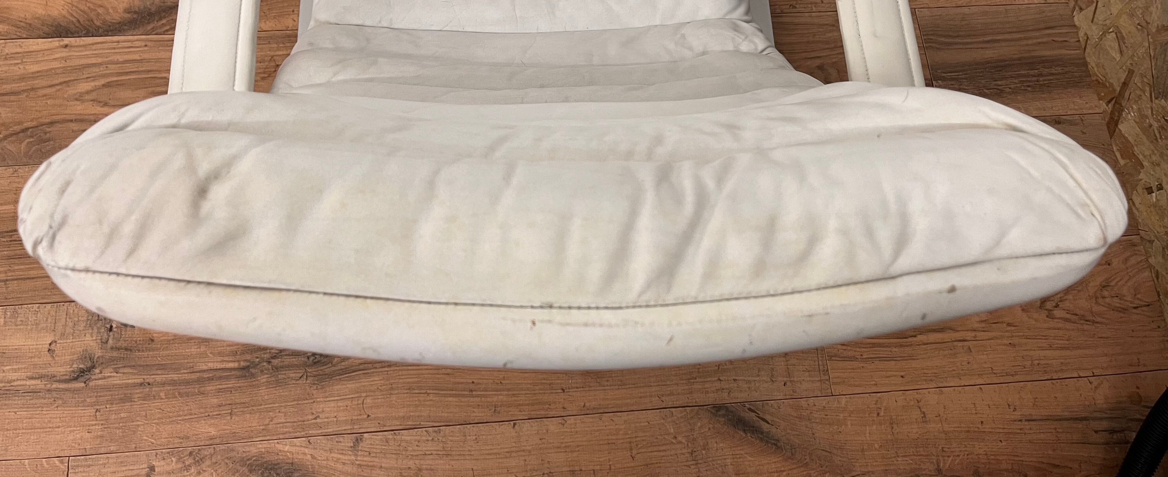 Pulkka armchair by Ilmaria Lappalainen and its ottoman