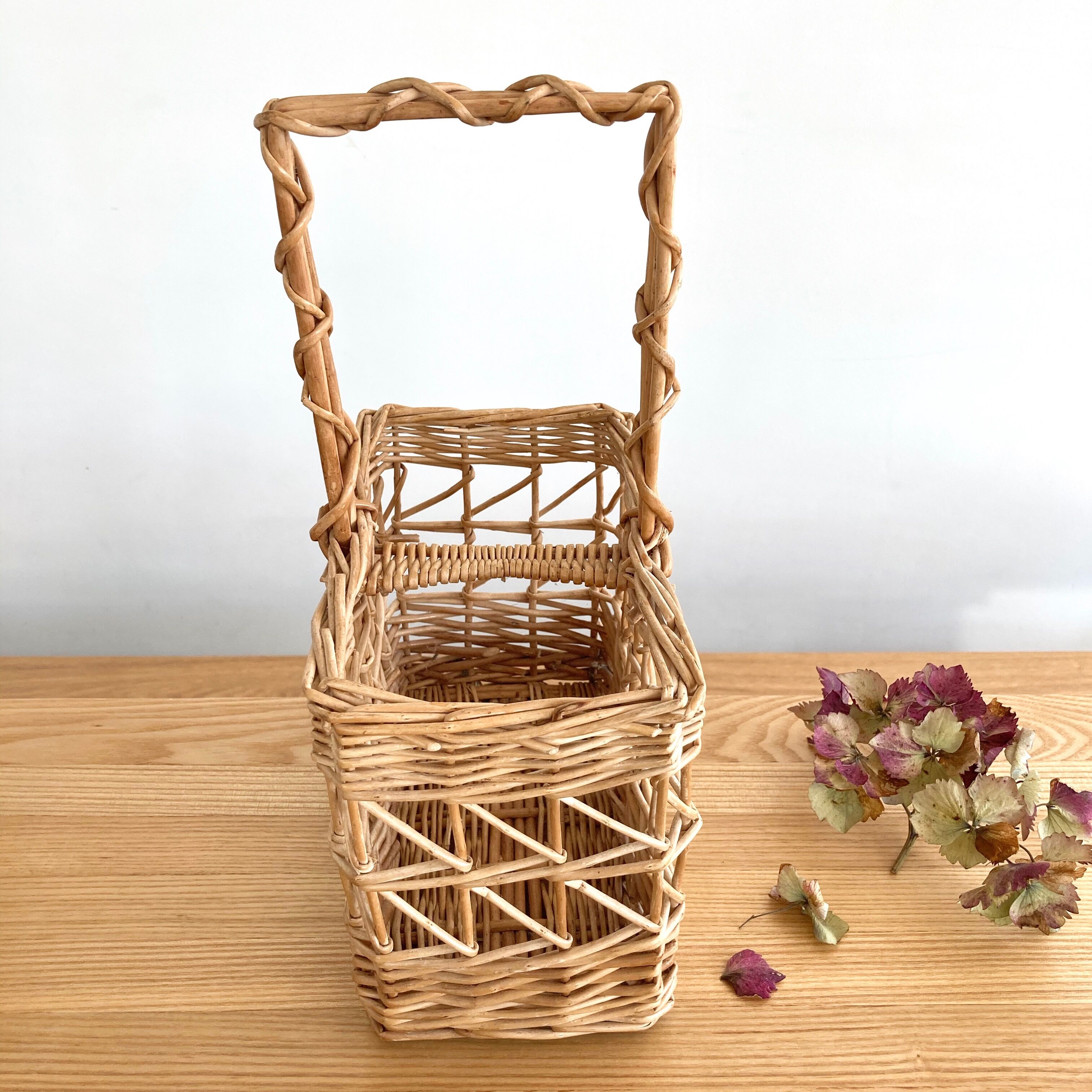 Vintage wicker bottle-bearer basket