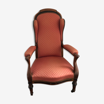 Fauteuil Voltaire à oreilles et roulettes