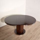 Round dining table with 1970s Italian design extension