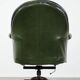 Large Chesterfield office armchair in green cowhide, in English style, on wheels.