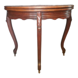Half-moon mahogany game table on casters