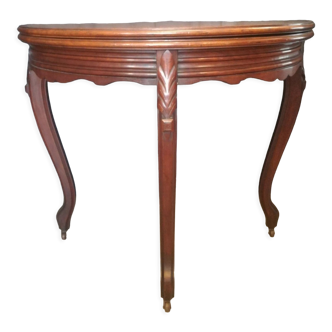 Half-moon mahogany game table on casters