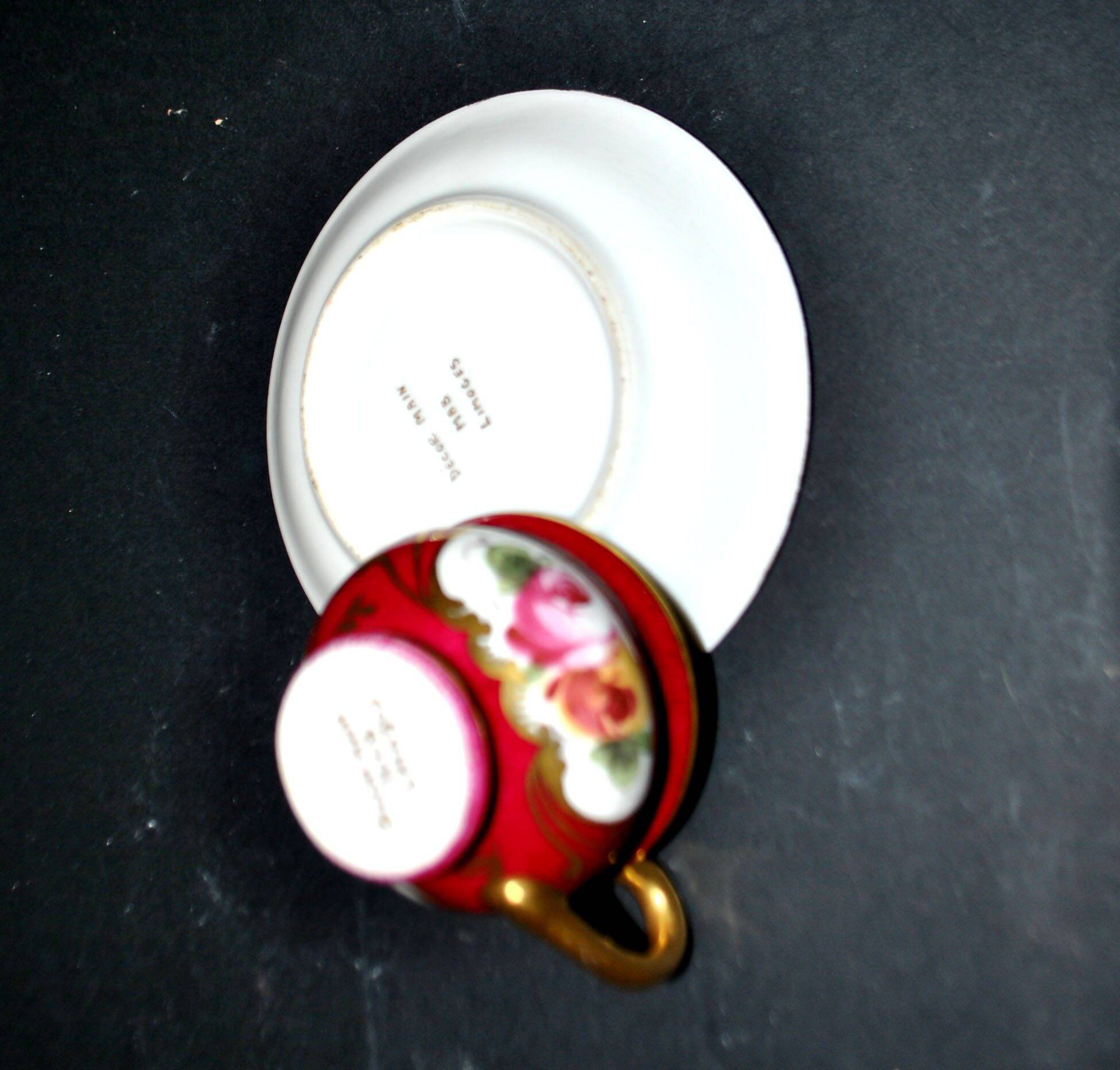 Limoges precious porcelain cup decorated in fuchsia pink and gold, signed MAB